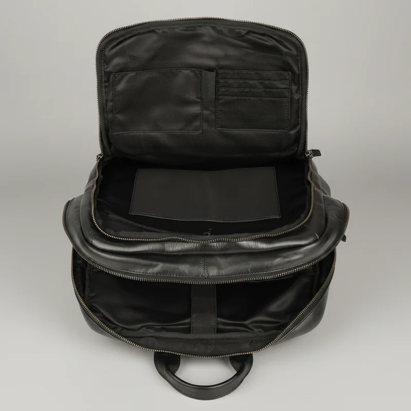 MET Two Adjustable Strap Leather Backpack. Multi-Compartment Commuter Pack